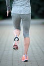 A woman with an athletic pair of legs going for a jog or run out Royalty Free Stock Photo