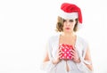 Woman attractive lady wear dress and santa hat. Girl hold box opening christmas gift. Girl celebrate christmas Royalty Free Stock Photo