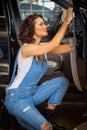 Woman auto mechanic in a garage