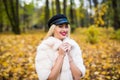 Woman autumn portrait. Fashion girl outdoor. Autumn woman having fun at the park and smiling. young woman portrait in autumn color Royalty Free Stock Photo