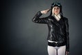 Woman with aviator helmet saluting