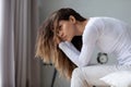 Woman awakened from night sleep feels negative emotions bad mood