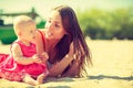 Woman and baby on beach