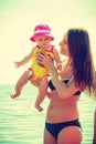 Woman and baby on beach