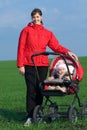 Woman with baby buggy Royalty Free Stock Photo