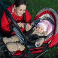 Woman with baby buggy Royalty Free Stock Photo