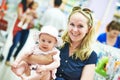 Woman with baby child in clothes shop Royalty Free Stock Photo