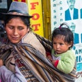 Woman with baby on a Cusco street Royalty Free Stock Photo