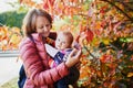 Woman and baby girl outdoors in park Royalty Free Stock Photo