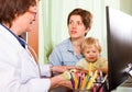 Woman with baby listening pediatrician doctor