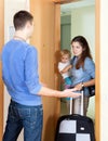 Woman with baby and suitcase