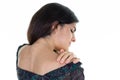 Woman back behind view in pain having headache hand on shoulder