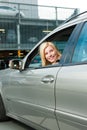 Woman back her car on a parking level