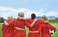 Woman, back and hug in soccer of sports team ready for match, game or outdoor practice with blue sky. Rear view of Royalty Free Stock Photo