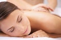 Woman, back massage at spa with aromatherapy and healing, physical therapy and wellness. Calm, natural and beauty with Royalty Free Stock Photo