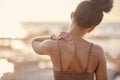 Woman, back or neck pain in nature fitness, beach workout or sunset training and anatomy crisis, muscle stress or