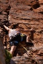 Woman, back and rock climbing for fitness in outdoors, challenge and rope for training. Female person, cliff and extreme