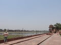 Woman back view, face not visible, admiring the tomb of Itimad-UD-Daul, small Taj Mahal, Agra, India Royalty Free Stock Photo