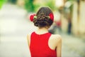 Woman back view with red roses in stylish hair Royalty Free Stock Photo