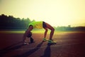 Woman backbending on stadium track