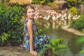 Woman on a background of flamingos on a pond Royalty Free Stock Photo