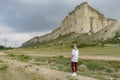 A woman on the background of a landscape view of the White Mountain in the Eastern Crimea. Photos of the Crimean
