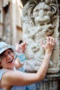 Woman on the background of a marble statue Royalty Free Stock Photo