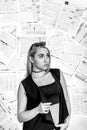 Woman at the background of newspapers Royalty Free Stock Photo