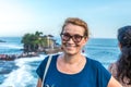 Woman on a background of Pura Tanah lot temple, Bali island, Indonesia.