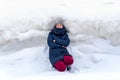 Woman on the background of a winter landscape with large hummocks, frozen ice, Jurmala, Latvia. Winter walk.