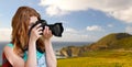 Woman with backpack and camera at big sur coast Royalty Free Stock Photo