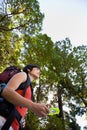 Woman with backpack and compass