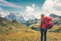 Woman with backpack enjoying mountains