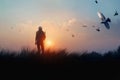 Woman with backpack enjoying sunset on grass peak hill. Bird in the sky. Tourist traveler on sunset background valley landscape. S Royalty Free Stock Photo