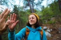 A woman with a backpack gives five to a friend Royalty Free Stock Photo