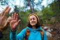 A woman with a backpack gives five to a friend Royalty Free Stock Photo