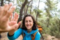 A woman with a backpack gives five to a friend Royalty Free Stock Photo