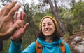 A woman with a backpack greets a friend Royalty Free Stock Photo