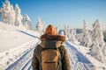 Woman with backpack hiking in winter mountains Royalty Free Stock Photo