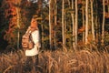 Woman with backpack, jacket and knit hat hiking outdoors Royalty Free Stock Photo