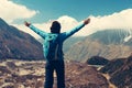 Woman with backpack and raised up arms. Vintage Royalty Free Stock Photo