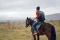 woman with backpack riding horse nature walk friendship Royalty Free Stock Photo