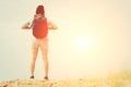 Woman with backpack standing on the beach, travel concetp Royalty Free Stock Photo