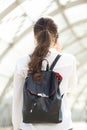 Woman with backpack talking on mobile