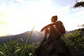 Woman backpacker enjoy the view on mountain peak Royalty Free Stock Photo