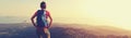 Woman backpacker enjoy the view on mountain peak Royalty Free Stock Photo