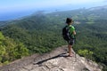 Woman backpacker enjoy the view on mountain peak Royalty Free Stock Photo