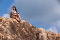 Woman backpacker and photo camera hiking in the mountain peak Royalty Free Stock Photo