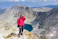 Woman backpacker standing mountain.