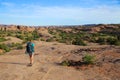 Woman backpacking in desert southwest landscape